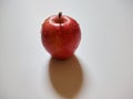 Single red apple with water drops isolated on white background. Royalty Free Stock Photo