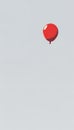 Single Red Balloon Floating Against Light Gray Background Minimalist Pixel Art Illustration Royalty Free Stock Photo
