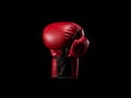 Single red boxing glove on black isolated background. AI Generated Image Royalty Free Stock Photo