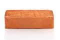 Single red brick on white background Royalty Free Stock Photo