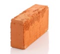 Single red brick on white background Royalty Free Stock Photo