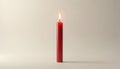 A single red candle burns with a bright flame. The candle stands alone against a soft background. The burning candle creates a Royalty Free Stock Photo