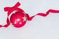 A Single Red Christmas Ball Sitting On A White Background.