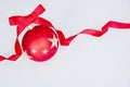 A Single Red Christmas Ball Sitting On A White Background.