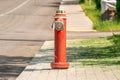 Red fire hydrant standing on the pavement Royalty Free Stock Photo