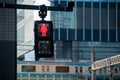 Single Red man stop traffic sign in front of Tokyo train station Royalty Free Stock Photo
