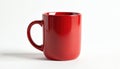 Single red mug sits empty on white surface. Clean ceramic cup with handle offers blank space for custom text or logo design. Royalty Free Stock Photo