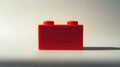 red lego brick on a white surface Royalty Free Stock Photo