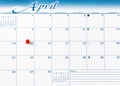 Single red pushpin on April 15 of calendar for tax income due date reminder in overhead view