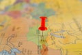 Single red pushpin marking a location on an open map Royalty Free Stock Photo