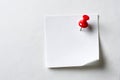 Single red pushpin on white note Royalty Free Stock Photo