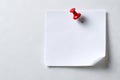 Single red pushpin on white note Royalty Free Stock Photo