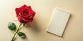 A single red rose and a blank spiral notebook on a beige background, ready for your message. Generative AI Royalty Free Stock Photo