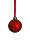 Single Red Christmas Ornament Hanging from a Red Ribbon Royalty Free Stock Photo