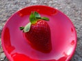 Strawberry on a red plate