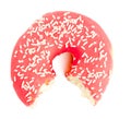 Half eaten red Donut with sugar sprinkles