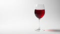 Single red wine glass, crisp white backdrop, elegant shadow, delicious, clean Royalty Free Stock Photo