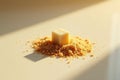 A single refined sugar cube rests atop a mound of granulated brown sugar, bathed in warm sunlight. Generative AI Royalty Free Stock Photo