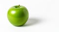 A Single Ripe Green Apple on a White Background with a Subtle Shadow Royalty Free Stock Photo