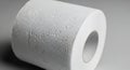 A single roll of white toilet paper presented on a gray background Royalty Free Stock Photo