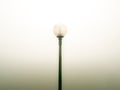 Single Round Lamp on a Black Pole Royalty Free Stock Photo