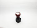 Single round office stamp with a maroon handle on a white background Royalty Free Stock Photo