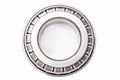 Single row tapered roller bearing made of chromed metal is designed to absorb radial and one-sided axial loads on the Royalty Free Stock Photo