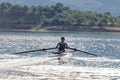 Single rower at sunrise