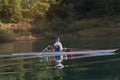 Single rower at sunrise