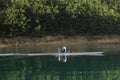 Single rower at sunrise