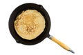 Single russian pancake in frying pan with wooden handle Royalty Free Stock Photo
