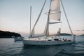 A single sailboat anchored in a quiet bay Royalty Free Stock Photo