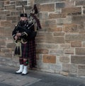 A single scottish piper in traditional kilt Royalty Free Stock Photo