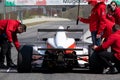 Single seater race car in pole position starting grid rear view on asphalt track