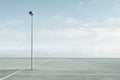 A single security camera mounted on a pole in a parking lot Royalty Free Stock Photo