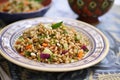 a single serving of farro salad on a patterned plate