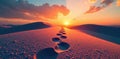 Single set of footprints leading towards distant horizon, light, beach Royalty Free Stock Photo