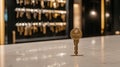 Single shiny key standing on clean countertop in modern locksmith workshop with blurred background. Concept of security
