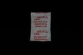 Single silica gel sachet or packet with red text