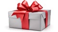 Single silver christmas gift wrapped in red ribbon and bow Royalty Free Stock Photo