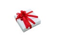 Single silver gift box with red ribbon isolated on white background Royalty Free Stock Photo