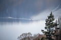 Sole rower on a calm lake