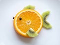 Creative Fish Shape Made From Orange Slice and Kiwi Fruit Royalty Free Stock Photo