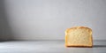 A single slice of freshly baked bread rests on a simple surface against a neutral backdrop. Generative AI Royalty Free Stock Photo