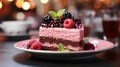 A single slice of Rasberry mousse cake in a red plate on table Royalty Free Stock Photo