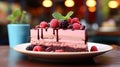 A single slice of Rasberry mousse cake in a red plate on table Royalty Free Stock Photo