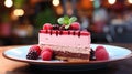 A single slice of Rasberry mousse cake in a red plate on table Royalty Free Stock Photo