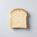 Single Slice of White Bread on a Light Background Royalty Free Stock Photo