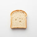 A single slice of white bread is positioned against a plain white background Royalty Free Stock Photo