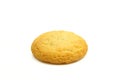 Single small golden treat cookie biscuit isolated on white background Royalty Free Stock Photo